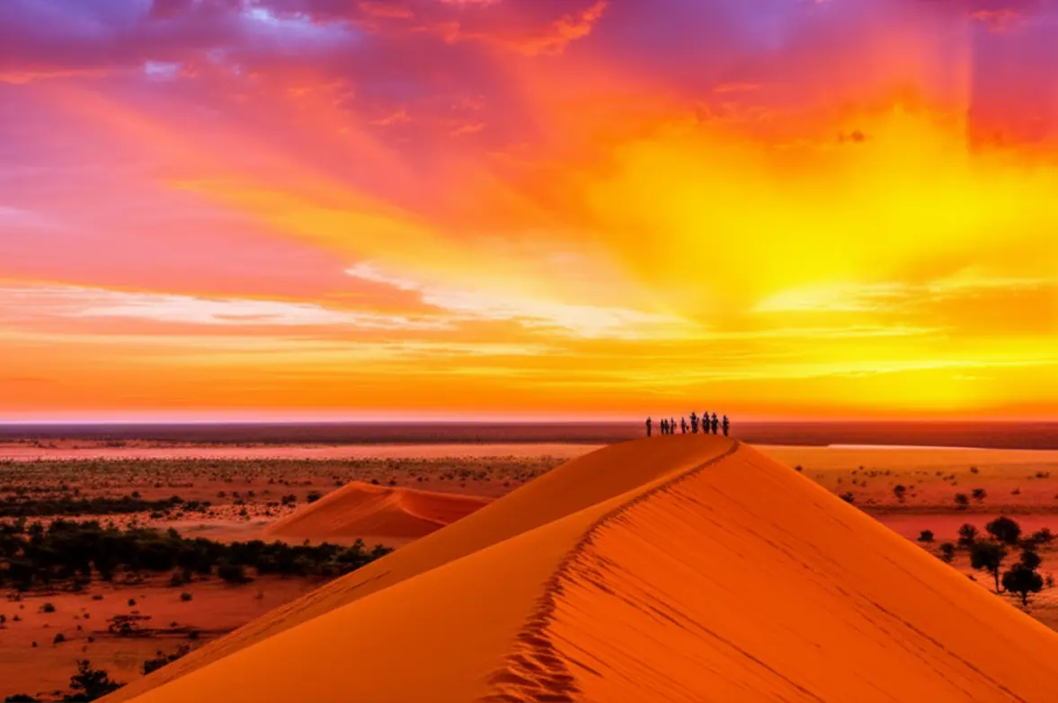 Pôr do sol espetacular nas Dunas do Jalapão com silhuetas de pessoas.