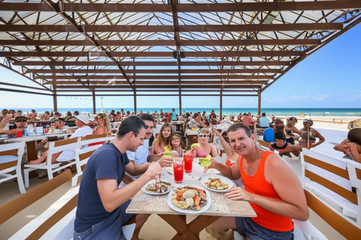 Pessoas comendo frutos do mar em barraca da Praia do Futuro.