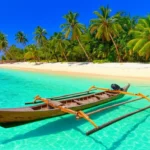 Vista panorâmica de uma praia paradisíaca nas Ilhas Gili com águas turquesa e areia branca.