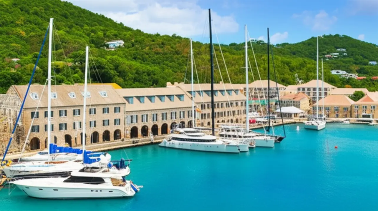 Vista aérea do Nelson's Dockyard em Antígua com edifícios históricos de pedra e barcos.