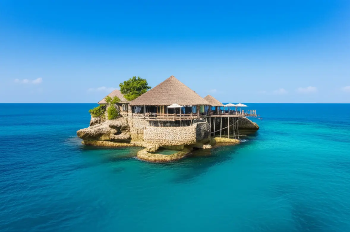 O icônico Restaurante The Rock em Zanzibar cercado pelo mar azul.